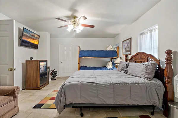 a bedroom with furniture and a window