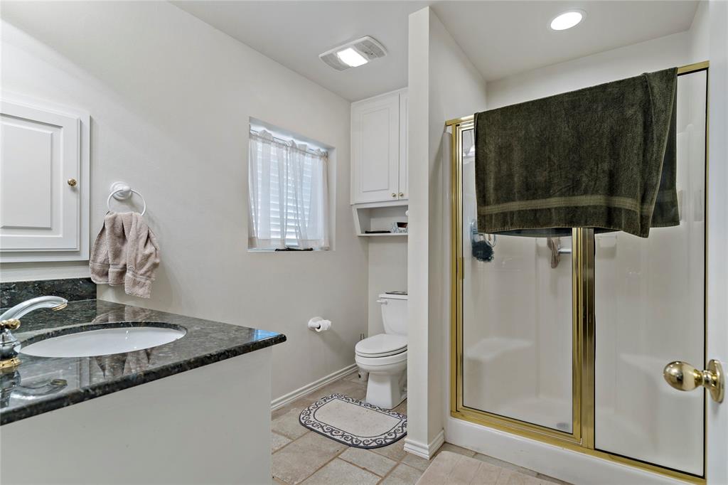 0 Fm 410 Detroit, TX 75436 - Photo 32 of 40 a bathroom with a granite countertop sink toilet and shower