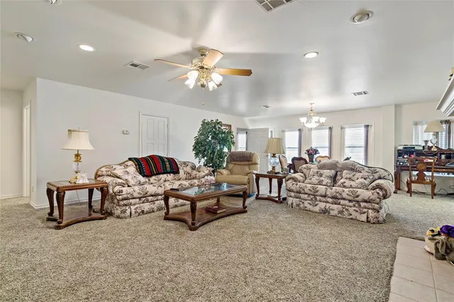 a kitchen with granite countertop a sink stainless steel appliances and cabinets