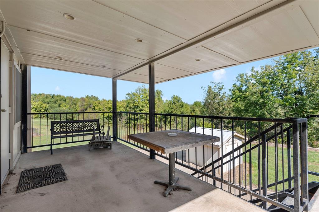 0 Fm 410 Detroit, TX 75436 - Photo 38 of 40 a view of a balcony with furniture and floor to ceiling window