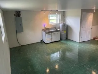 a kitchen with a refrigerator and window