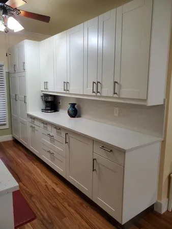 a bathroom with a sink mirror and toilet