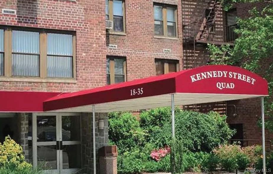 18-35 Corporal Kennedy Street, Unit 1F Queens, NY 11360 - Photo 1 of 9 a red sign board on the side of a building