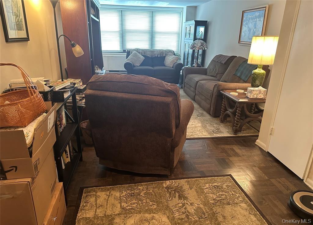 18-35 Corporal Kennedy Street, Unit 1F Queens, NY 11360 - Photo 2 of 9 a living room with furniture and a window