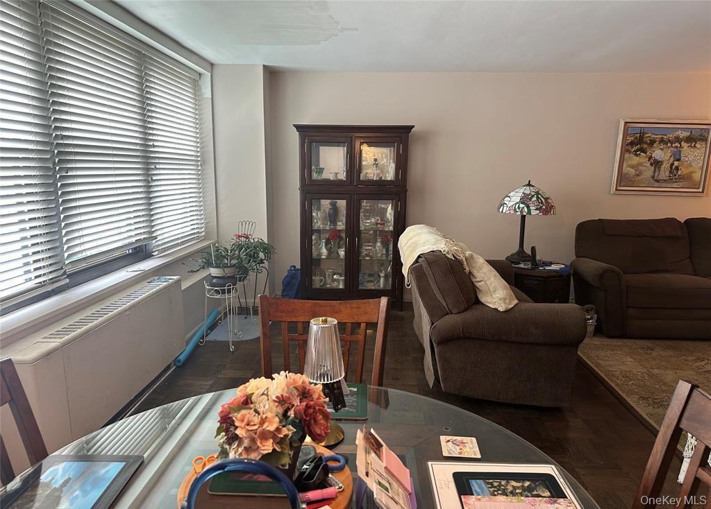 18-35 Corporal Kennedy Street, Unit 1F Queens, NY 11360 - Photo 5 of 9 a living room with furniture and a window