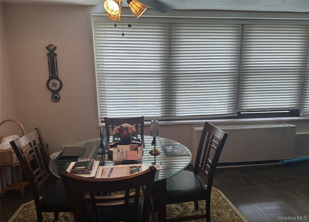 18-35 Corporal Kennedy Street, Unit 1F Queens, NY 11360 - Photo 6 of 9 a view of a dining room with furniture and window