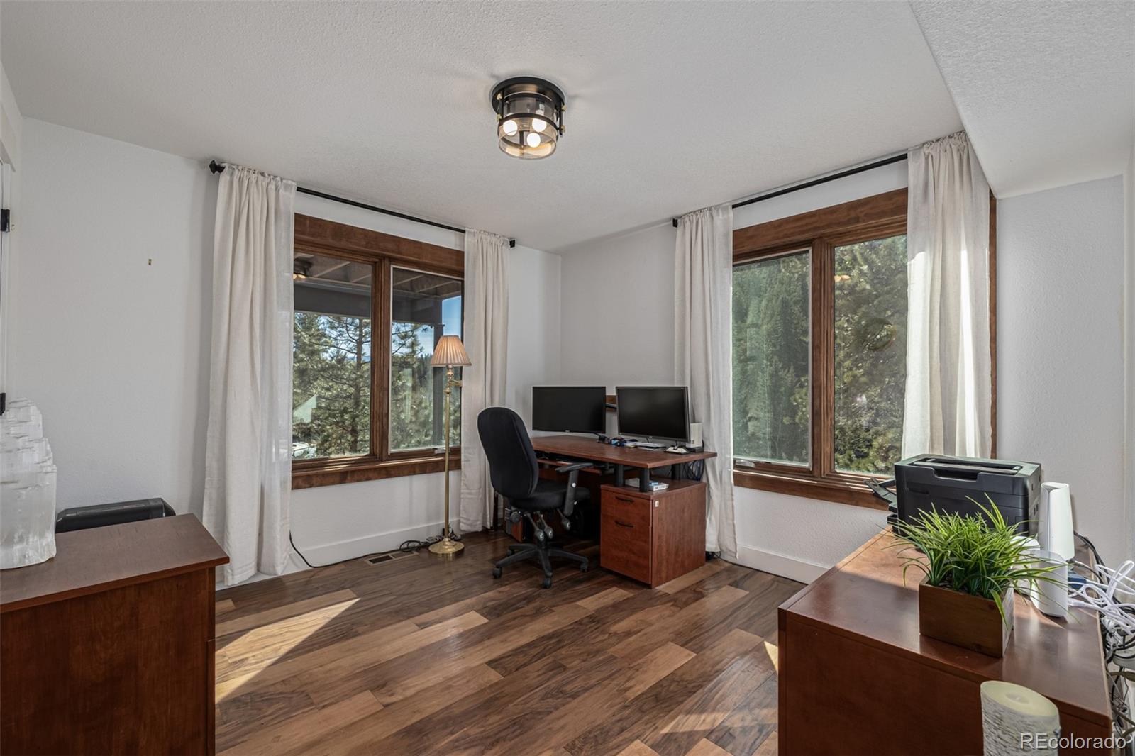 663 Brookside Drive Bailey, CO 80421 - Photo 28 of 47 a view of a livingroom with workspace and a window