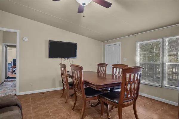 a view of a dining room with furniture window and outside view