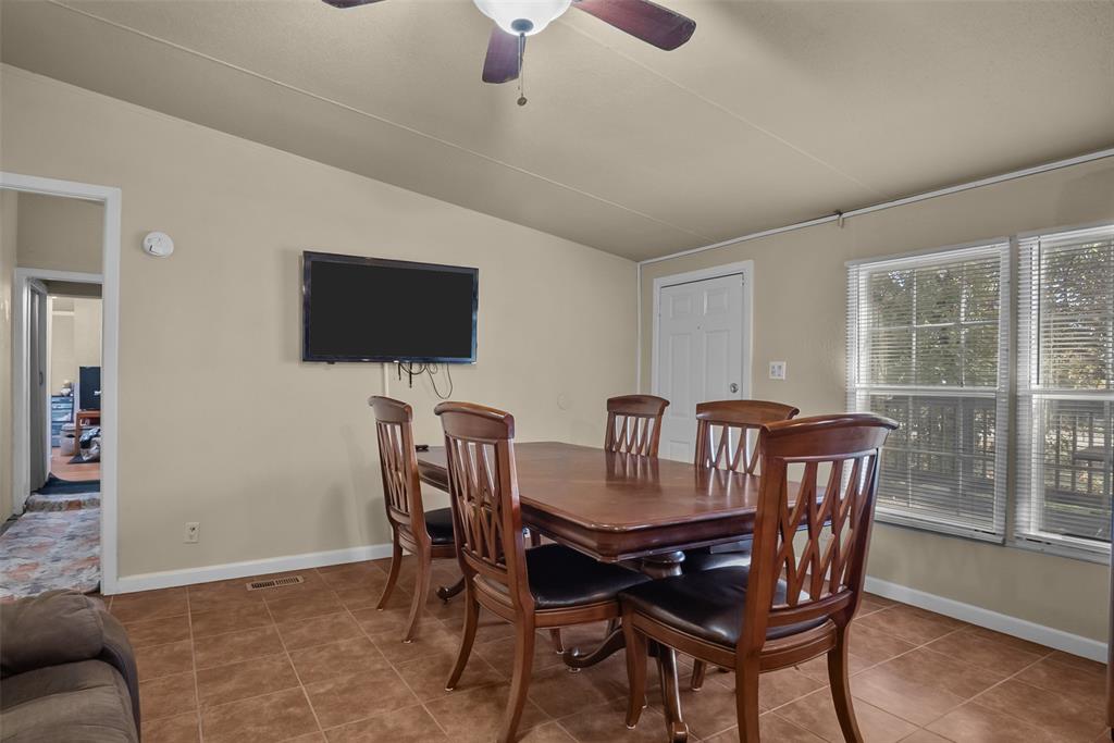 353 Prairie Lane Azle, TX 76020 - Photo 14 of 36 a view of a dining room with furniture window and outside view