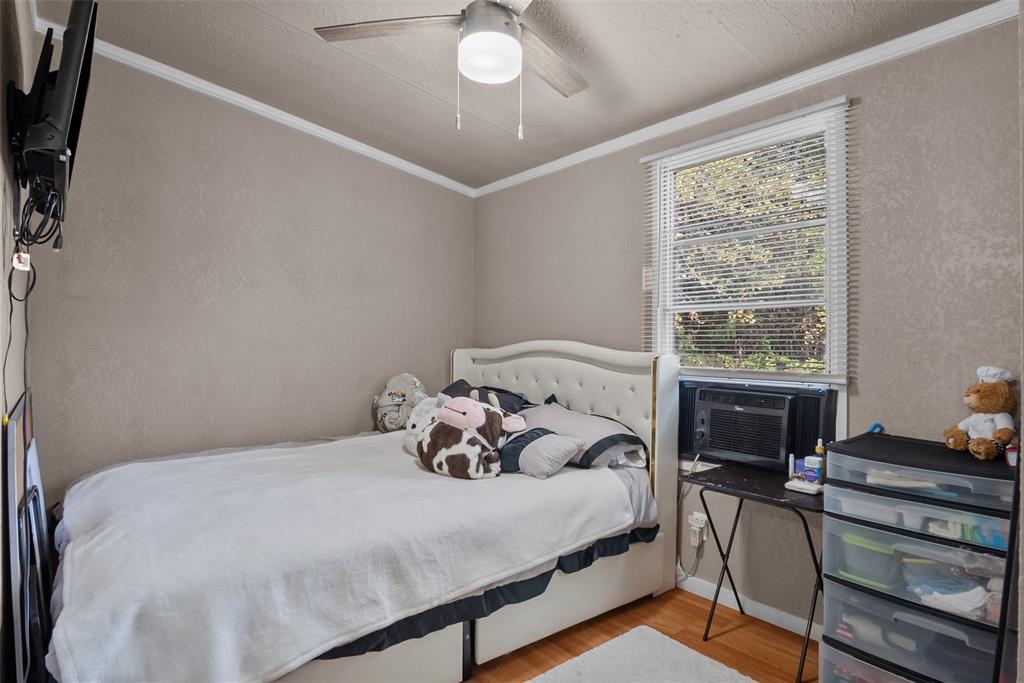 353 Prairie Lane Azle, TX 76020 - Photo 25 of 36 a bedroom with a bed and a window