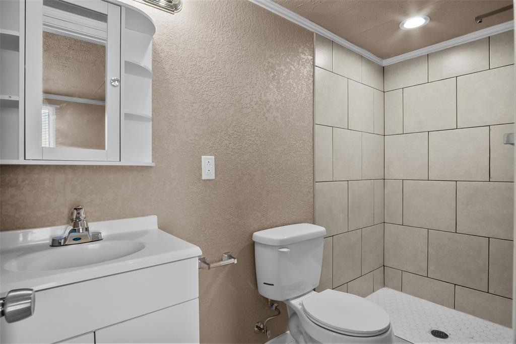 353 Prairie Lane Azle, TX 76020 - Photo 26 of 36 a bathroom with a sink toilet and shower