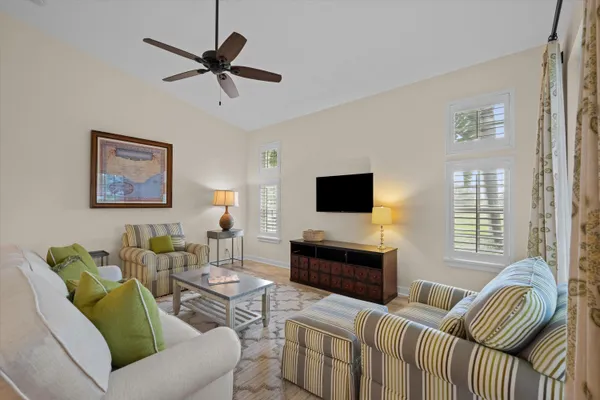 a large kitchen with kitchen island a large counter top space a sink stainless steel appliances and cabinets