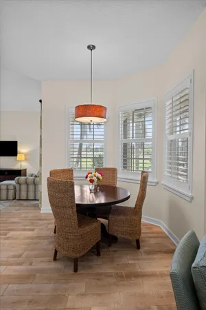 a spacious bathroom with double vanity a toilet a and a window