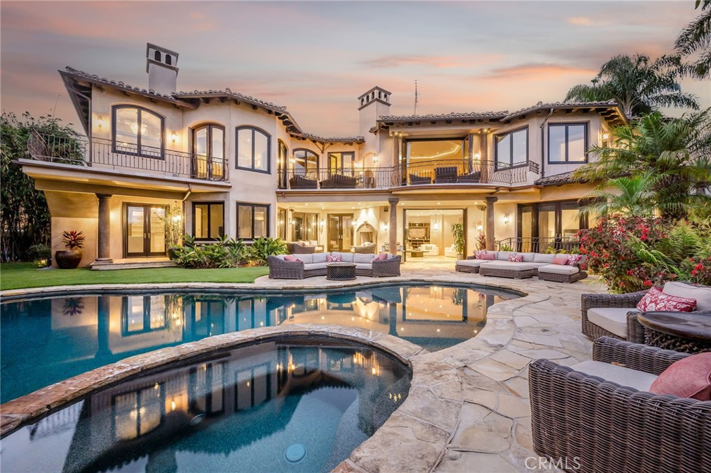 215 South Poinsettia Avenue Manhattan Beach, CA 90266 - Photo 1 of 64 a view of a building with a swimming pool and furniture