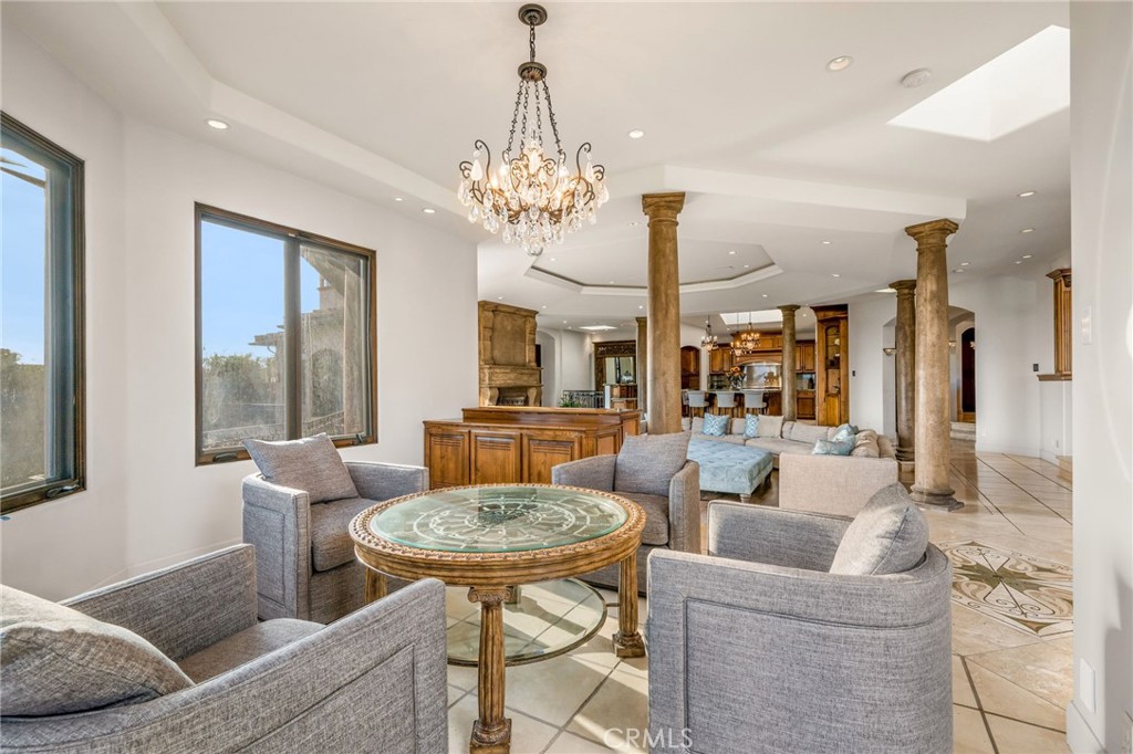 215 South Poinsettia Avenue Manhattan Beach, CA 90266 - Photo 19 of 64 a living room with furniture a chandelier and a chandelier
