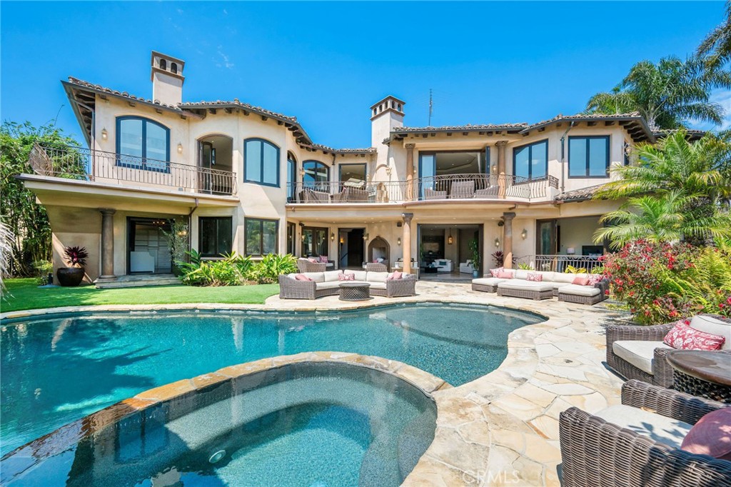 215 South Poinsettia Avenue Manhattan Beach, CA 90266 - Photo 3 of 64 a front view of a house with swimming pool having outdoor seating