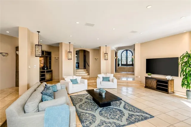 a bedroom with a bed and glass walk in closet