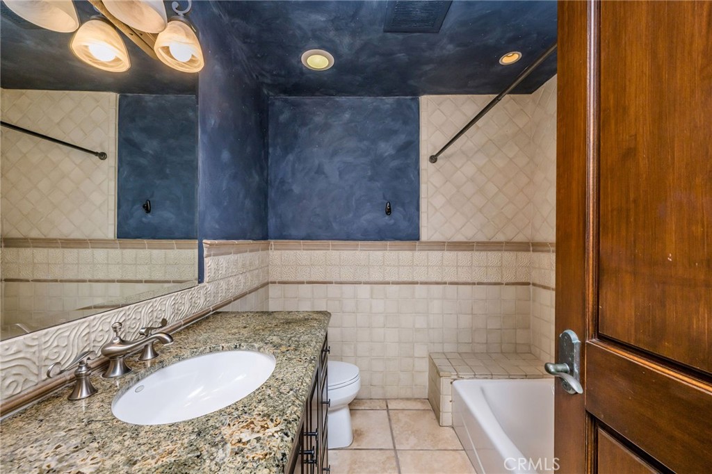 215 South Poinsettia Avenue Manhattan Beach, CA 90266 - Photo 36 of 64 a bathroom with a sink and a mirror