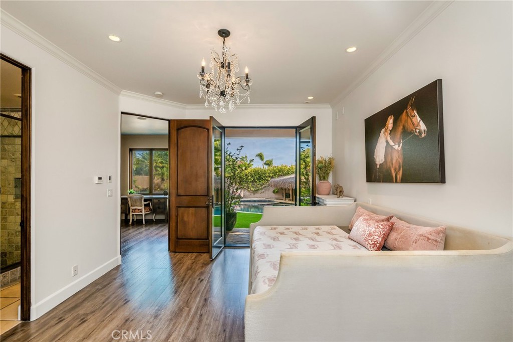 215 South Poinsettia Avenue Manhattan Beach, CA 90266 - Photo 37 of 64 a living room with furniture and a chandelier