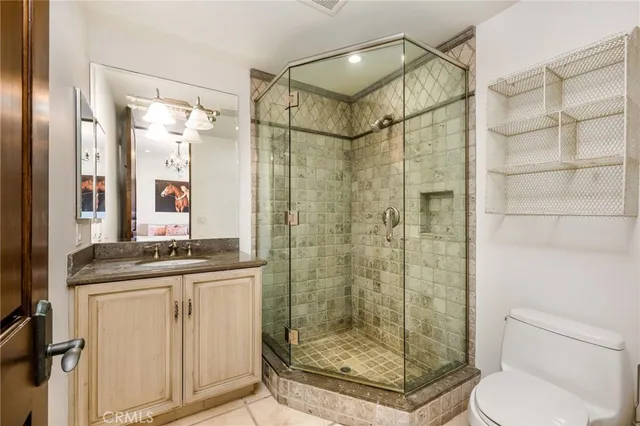 a living room with stainless steel appliances kitchen island granite countertop furniture and a wooden floor