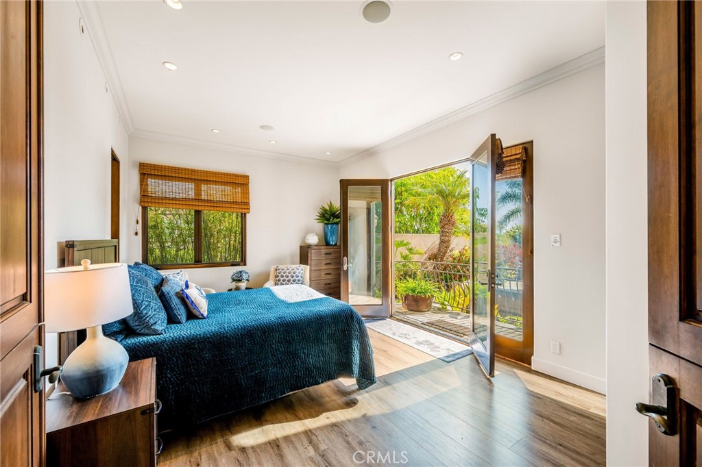 215 South Poinsettia Avenue Manhattan Beach, CA 90266 - Photo 40 of 64 a bedroom with a bed and glass walk in closet