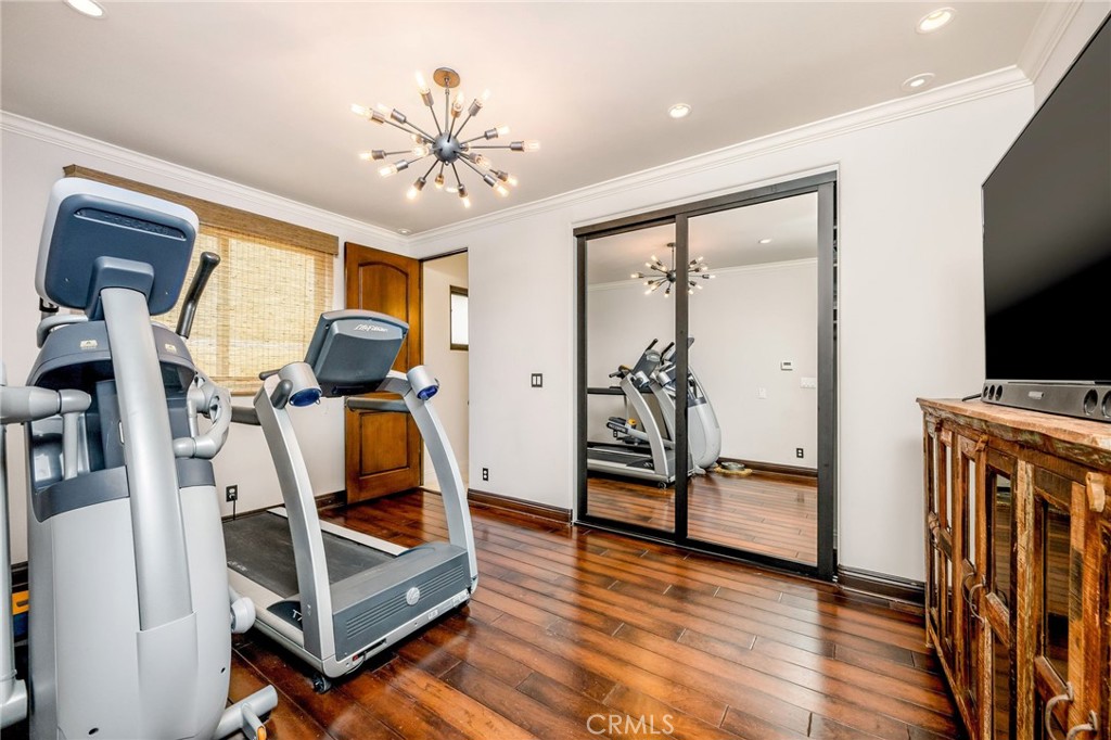 215 South Poinsettia Avenue Manhattan Beach, CA 90266 - Photo 41 of 64 a view of a room with wooden floor and furniture