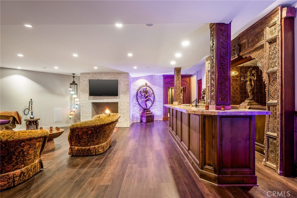 215 South Poinsettia Avenue Manhattan Beach, CA 90266 - Photo 45 of 64 a living room with furniture fireplace and flat screen tv
