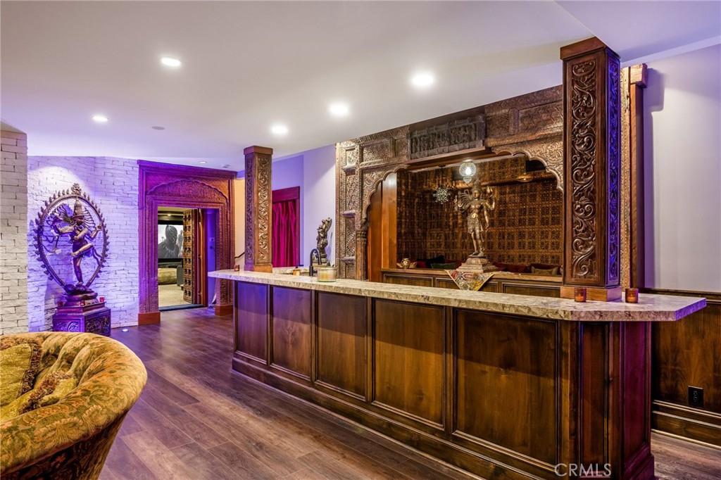 215 South Poinsettia Avenue Manhattan Beach, CA 90266 - Photo 46 of 64 a living room with stainless steel appliances kitchen island granite countertop furniture and a wooden floor