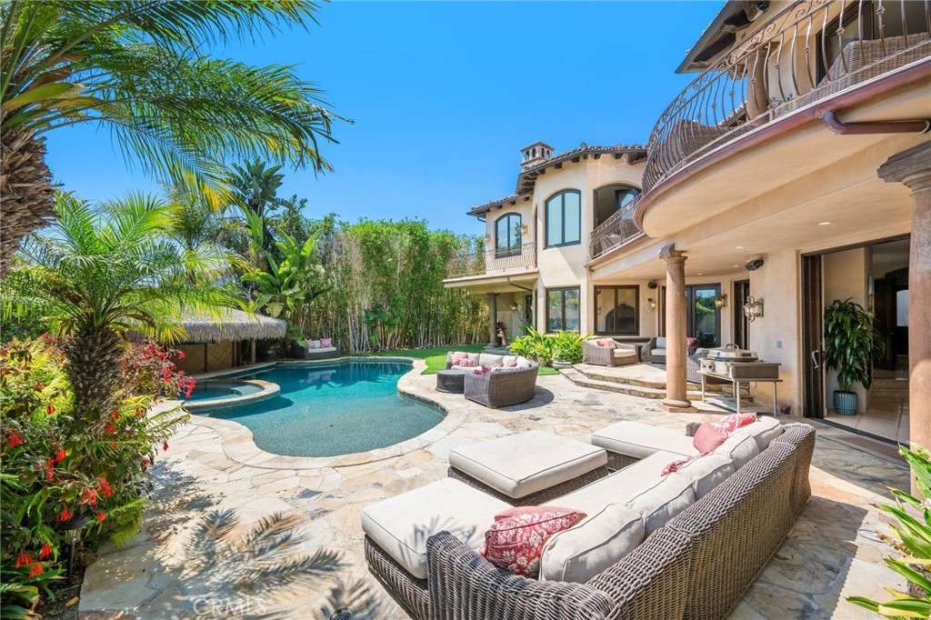 215 South Poinsettia Avenue Manhattan Beach, CA 90266 - Photo 52 of 64 a view of a patio with couches and table and chairs with wooden fence and plants