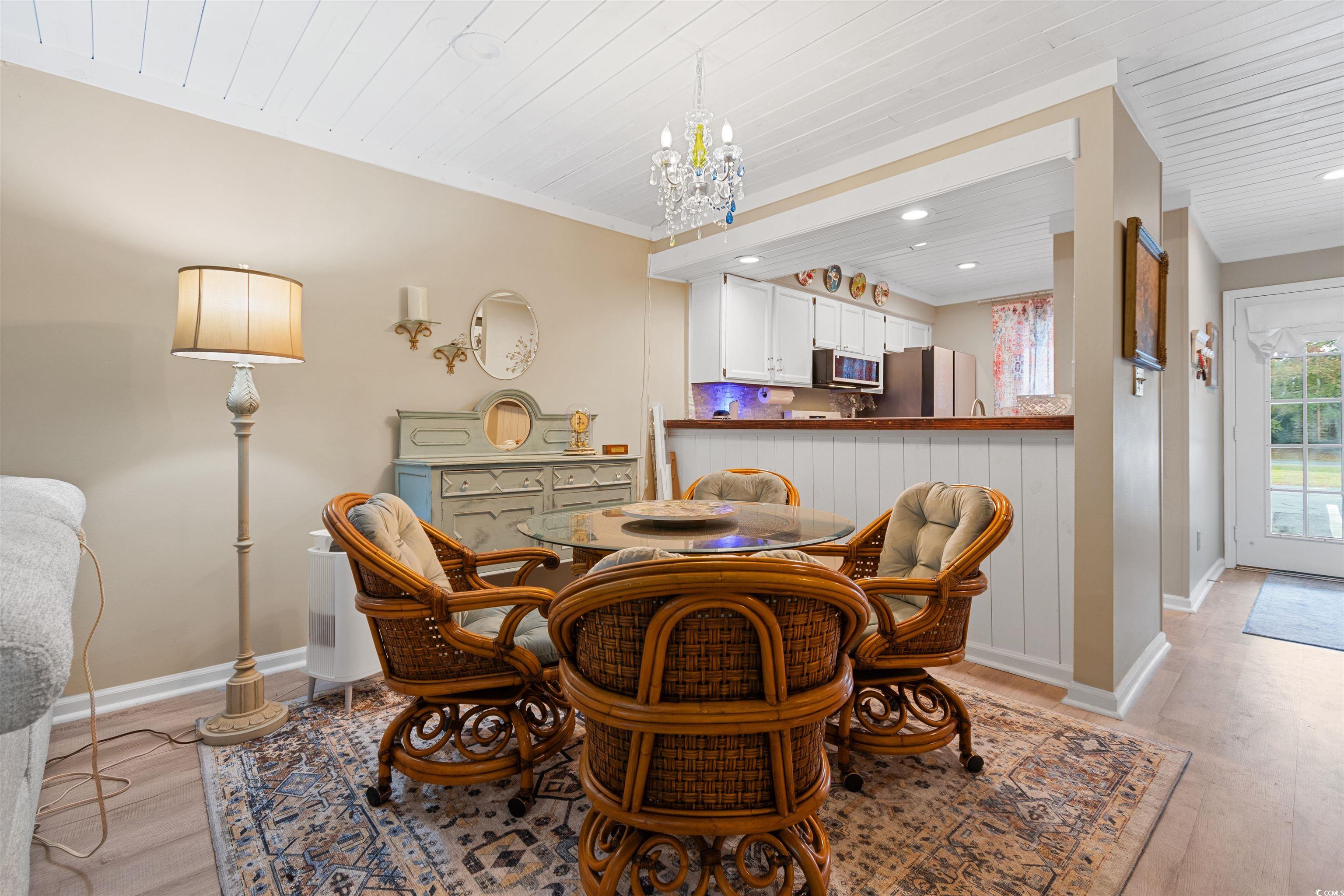 1830 Fairway Ridge Drive, Unit 6F Myrtle Beach, SC 29575 - Photo 12 of 31 Dining space with wood ceiling, a notable chandeli