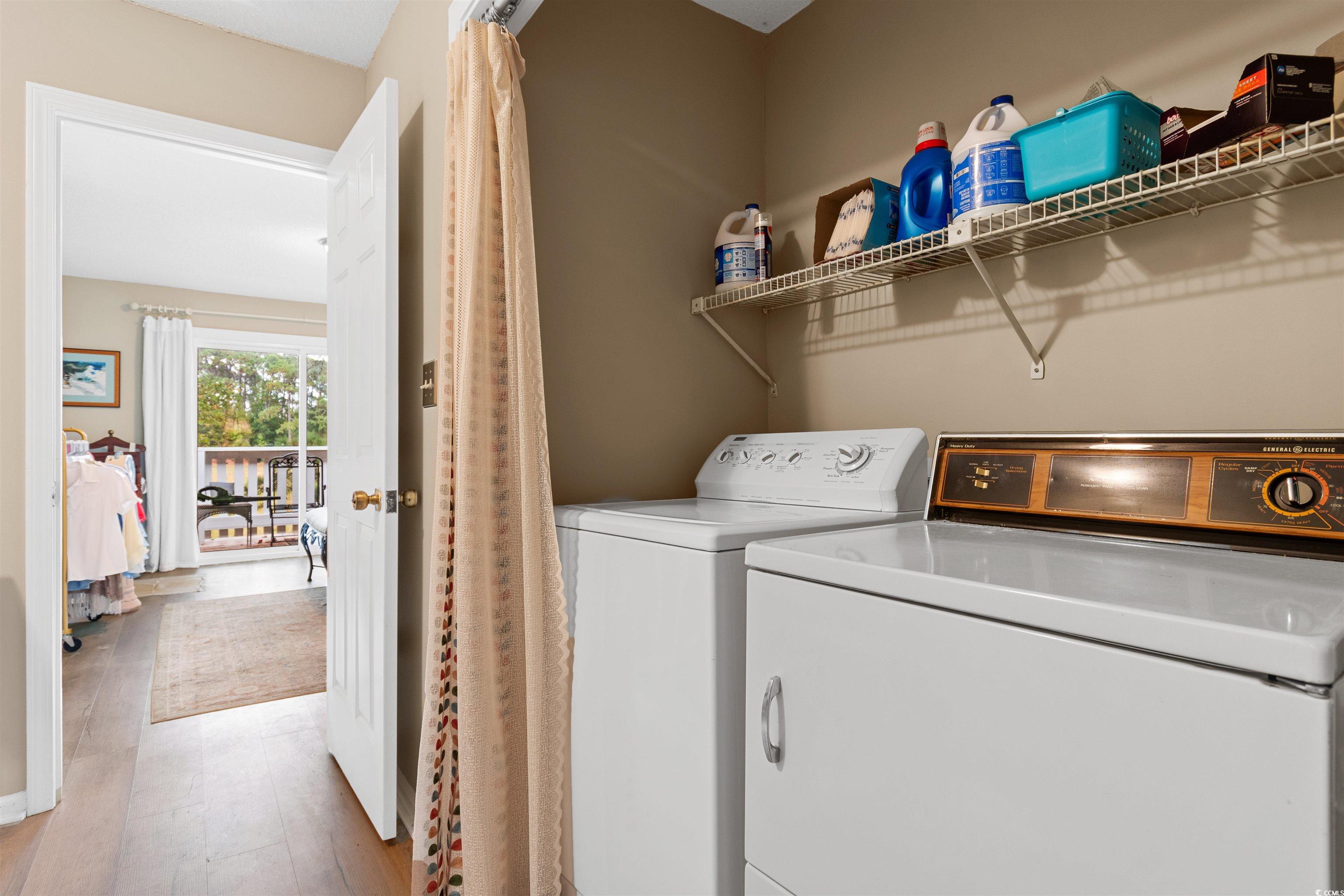 1830 Fairway Ridge Drive, Unit 6F Myrtle Beach, SC 29575 - Photo 21 of 31 Laundry room featuring washing machine and dryer a