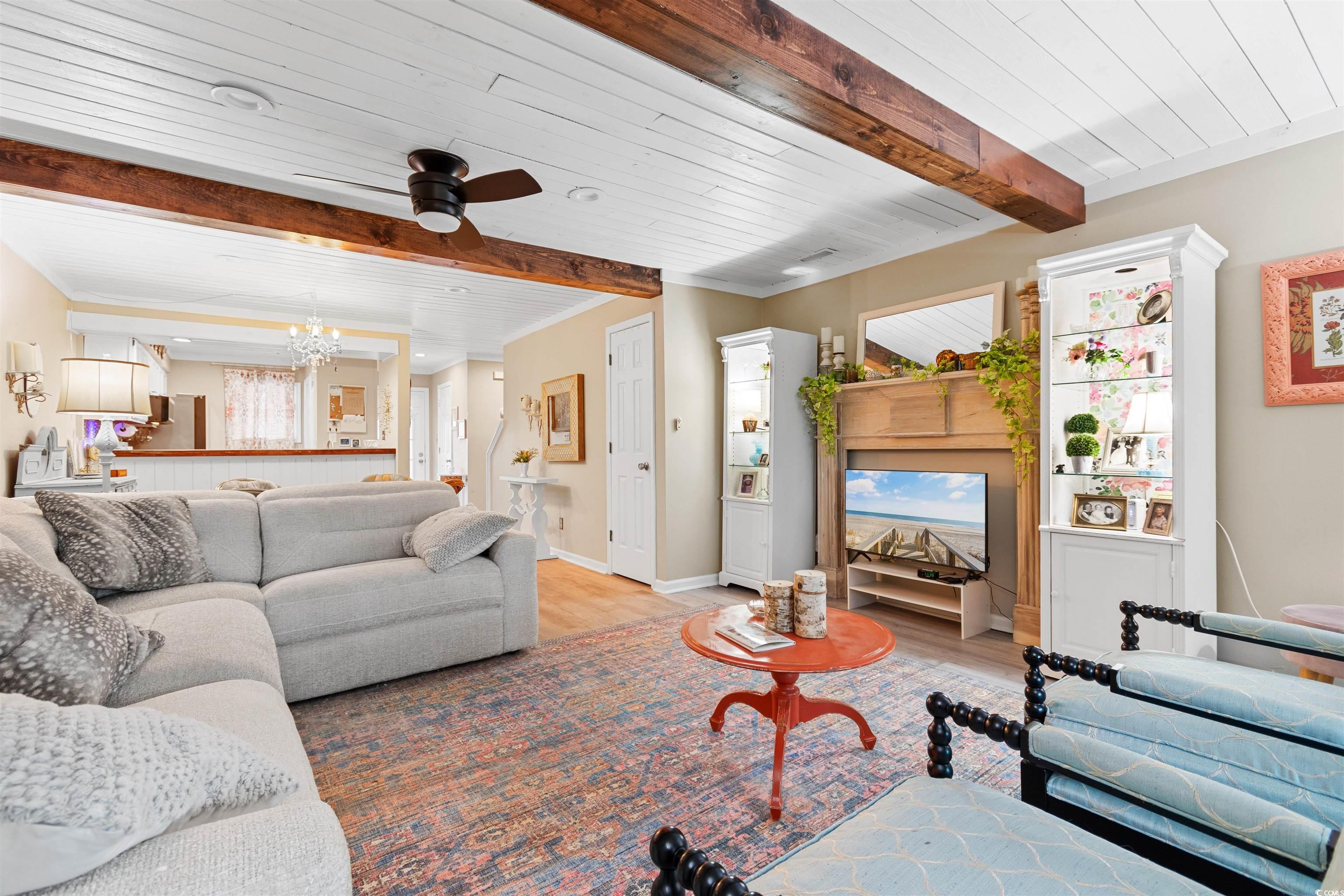 1830 Fairway Ridge Drive, Unit 6F Myrtle Beach, SC 29575 - Photo 6 of 31 Living room featuring wooden ceiling, beamed ceili