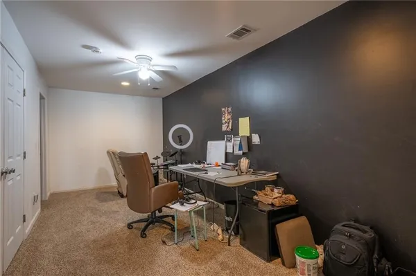 a workspace with furniture and chandelier