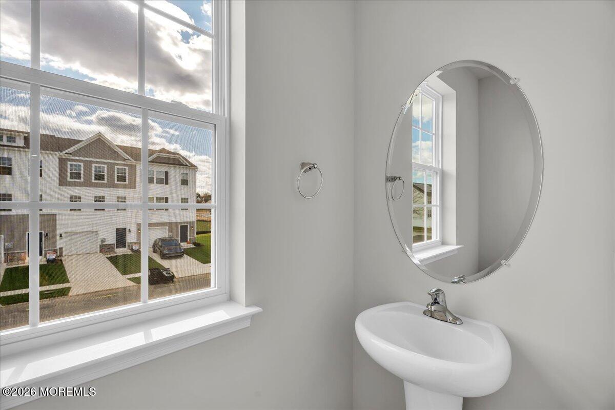 220 Sandy Rdg Road Sicklerville, NJ 08081 - Photo 13 of 24 a bathroom with a sink and a mirror