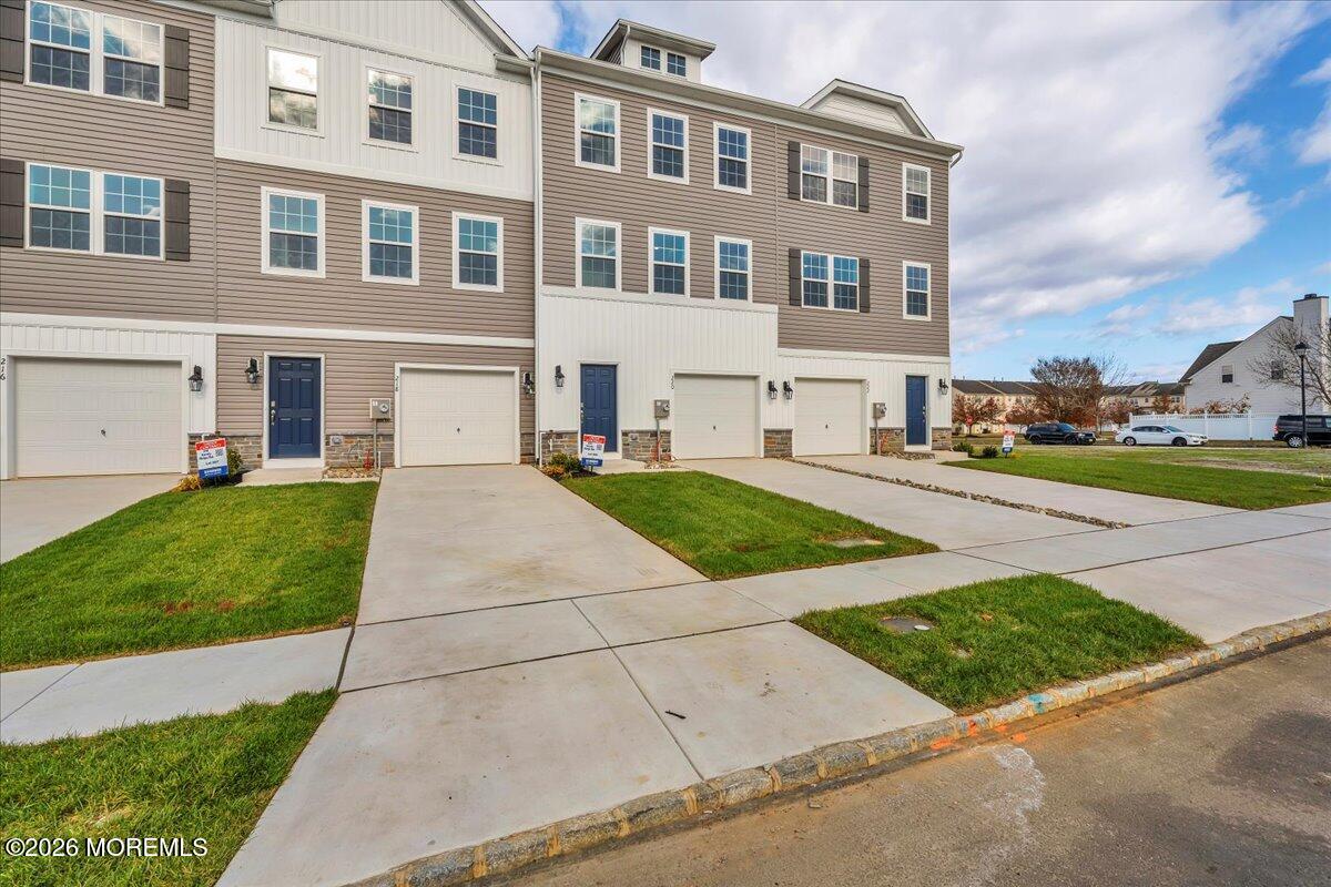 220 Sandy Rdg Road Sicklerville, NJ 08081 - Photo 3 of 24 a front view of a building with a garden and trees