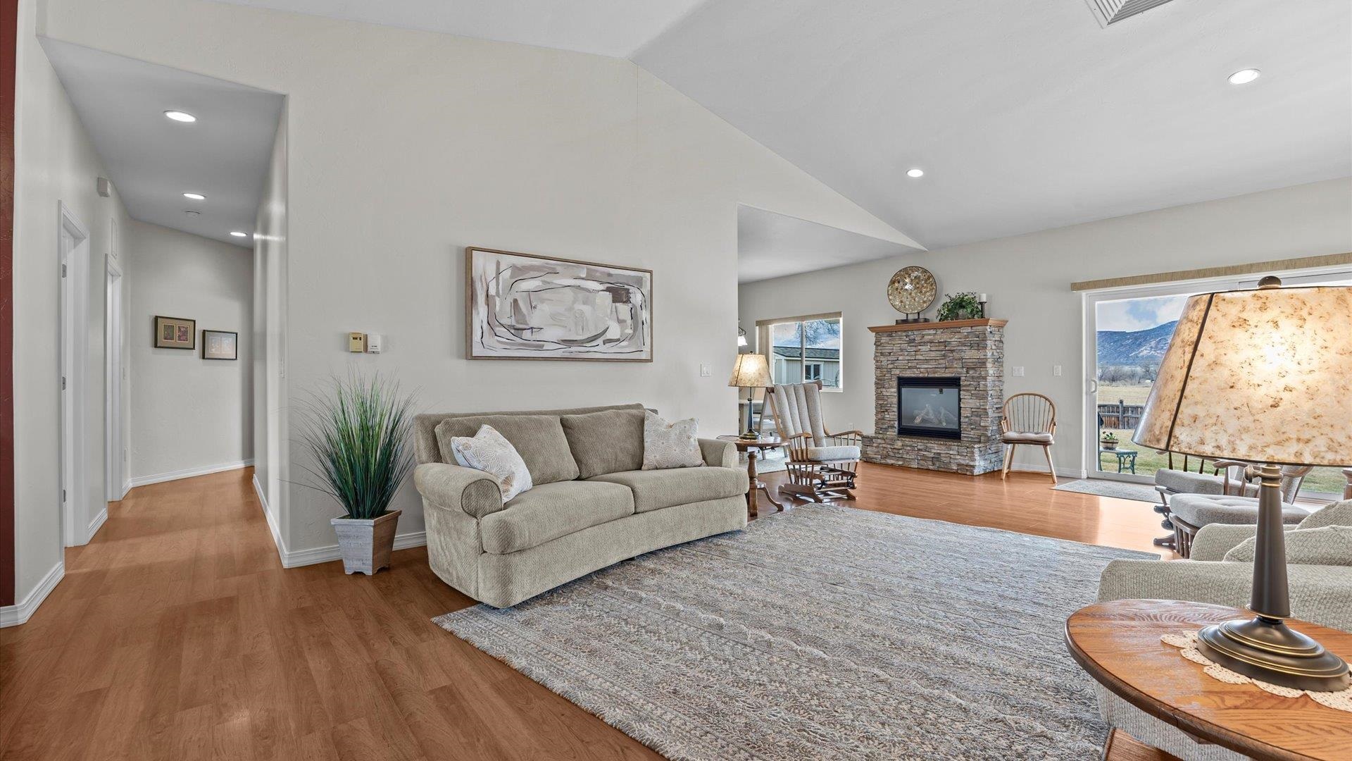640 Beech Avenue Fruita, CO 81521 - Photo 11 of 34 a living room with furniture and a fireplace