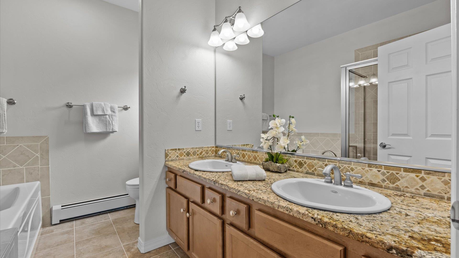 640 Beech Avenue Fruita, CO 81521 - Photo 21 of 34 a bathroom with a sink and a mirror
