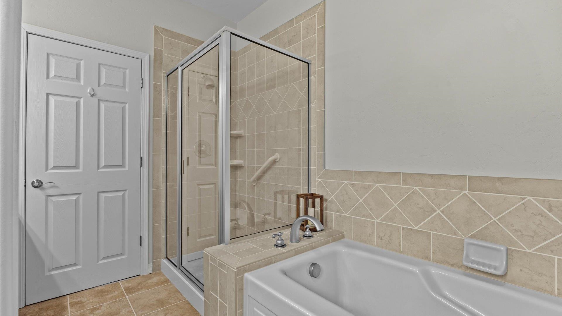 640 Beech Avenue Fruita, CO 81521 - Photo 22 of 34 a bathroom with a tub a sink and a shower