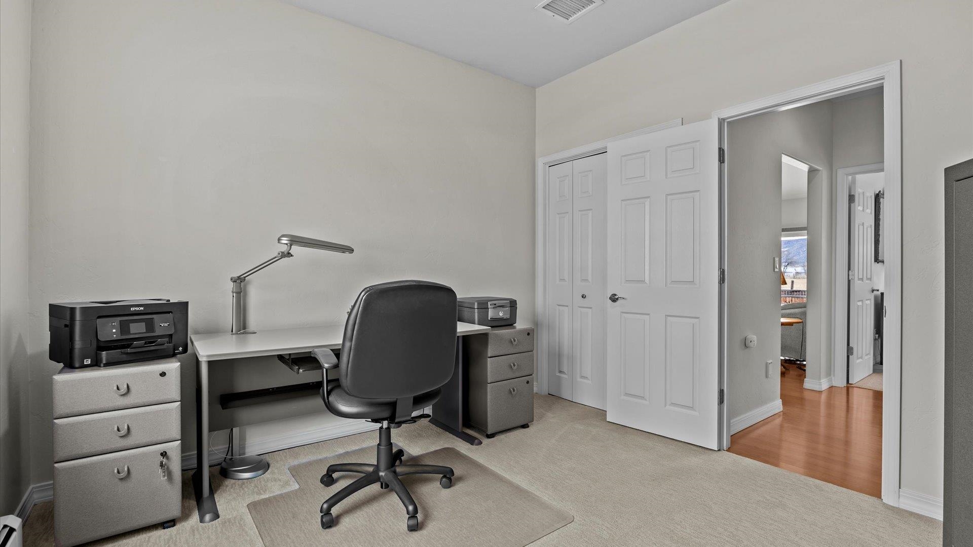 640 Beech Avenue Fruita, CO 81521 - Photo 24 of 34 a view of a workspace with furniture and gym equipment
