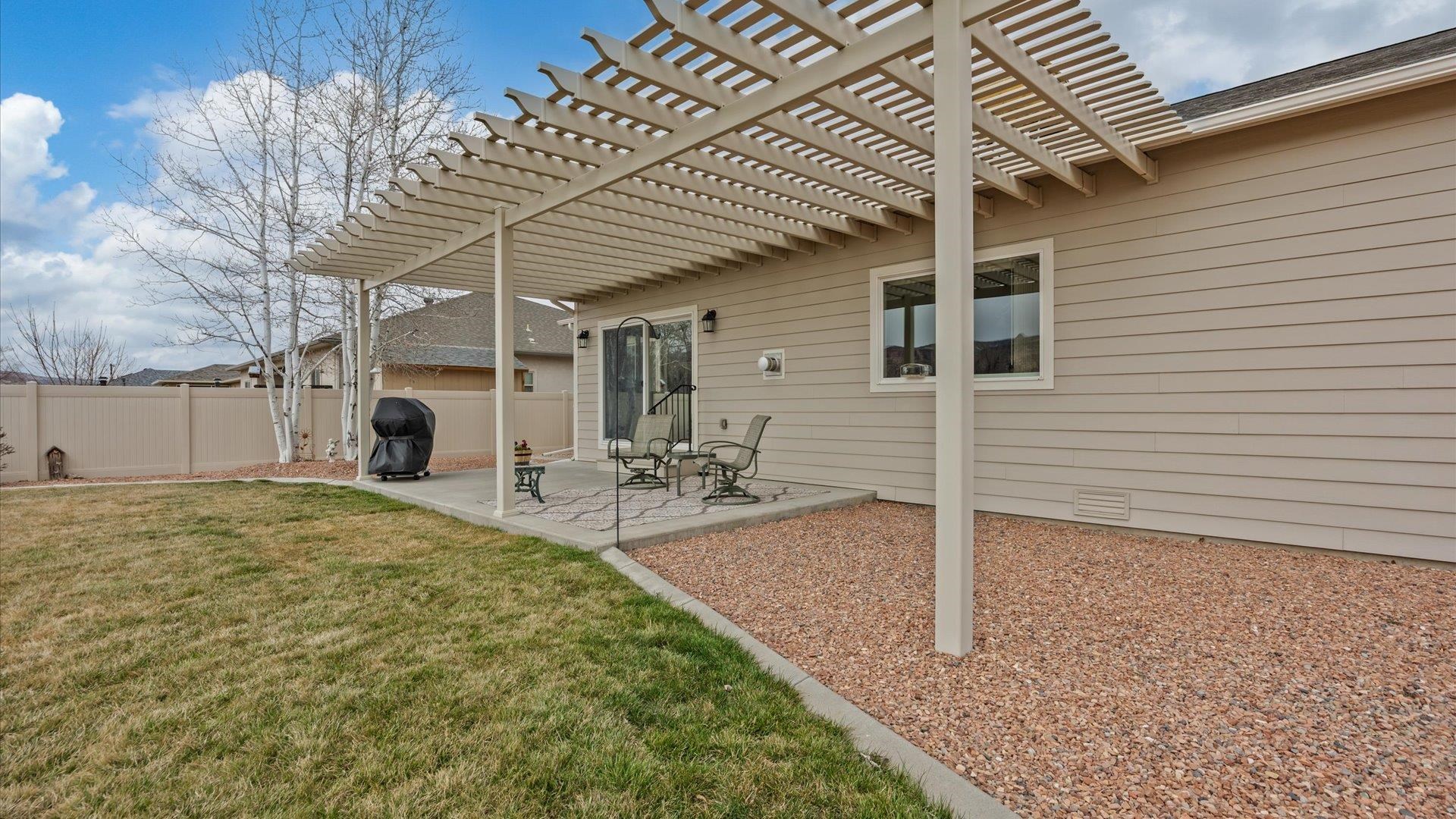 640 Beech Avenue Fruita, CO 81521 - Photo 28 of 34 a backyard of a house with table and chairs