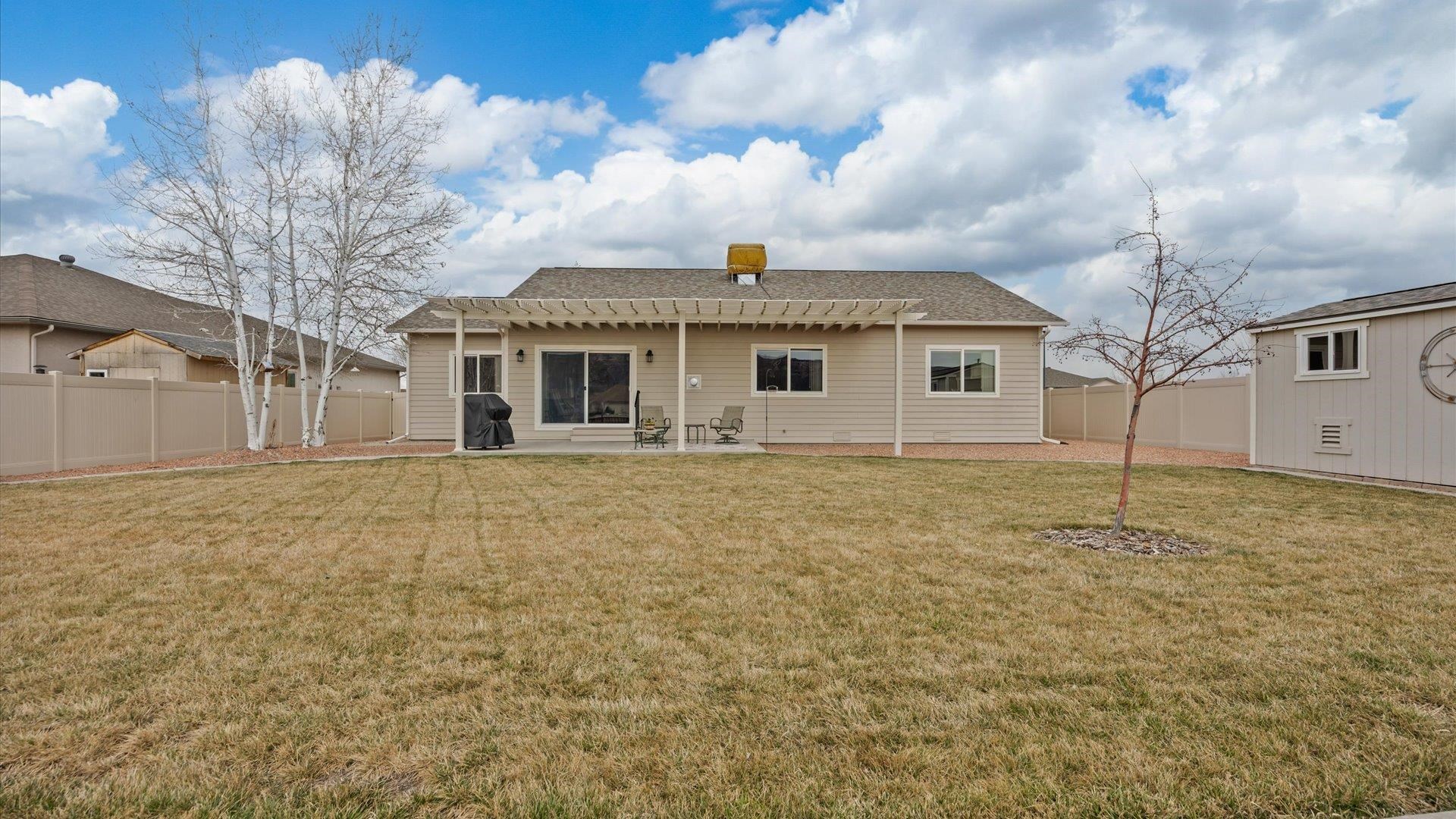 640 Beech Avenue Fruita, CO 81521 - Photo 30 of 34 a front view of a house with a garden