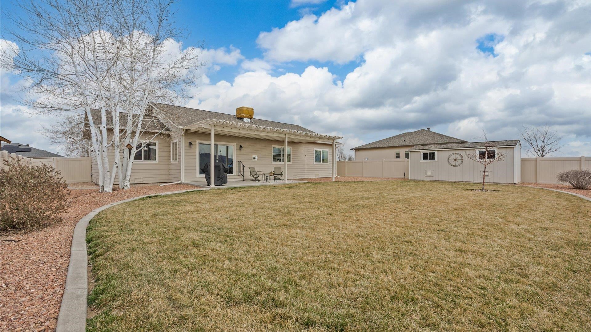 640 Beech Avenue Fruita, CO 81521 - Photo 31 of 34 a front view of a house with a garden