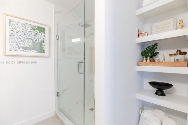 a picture of a bathroom microwave and a window