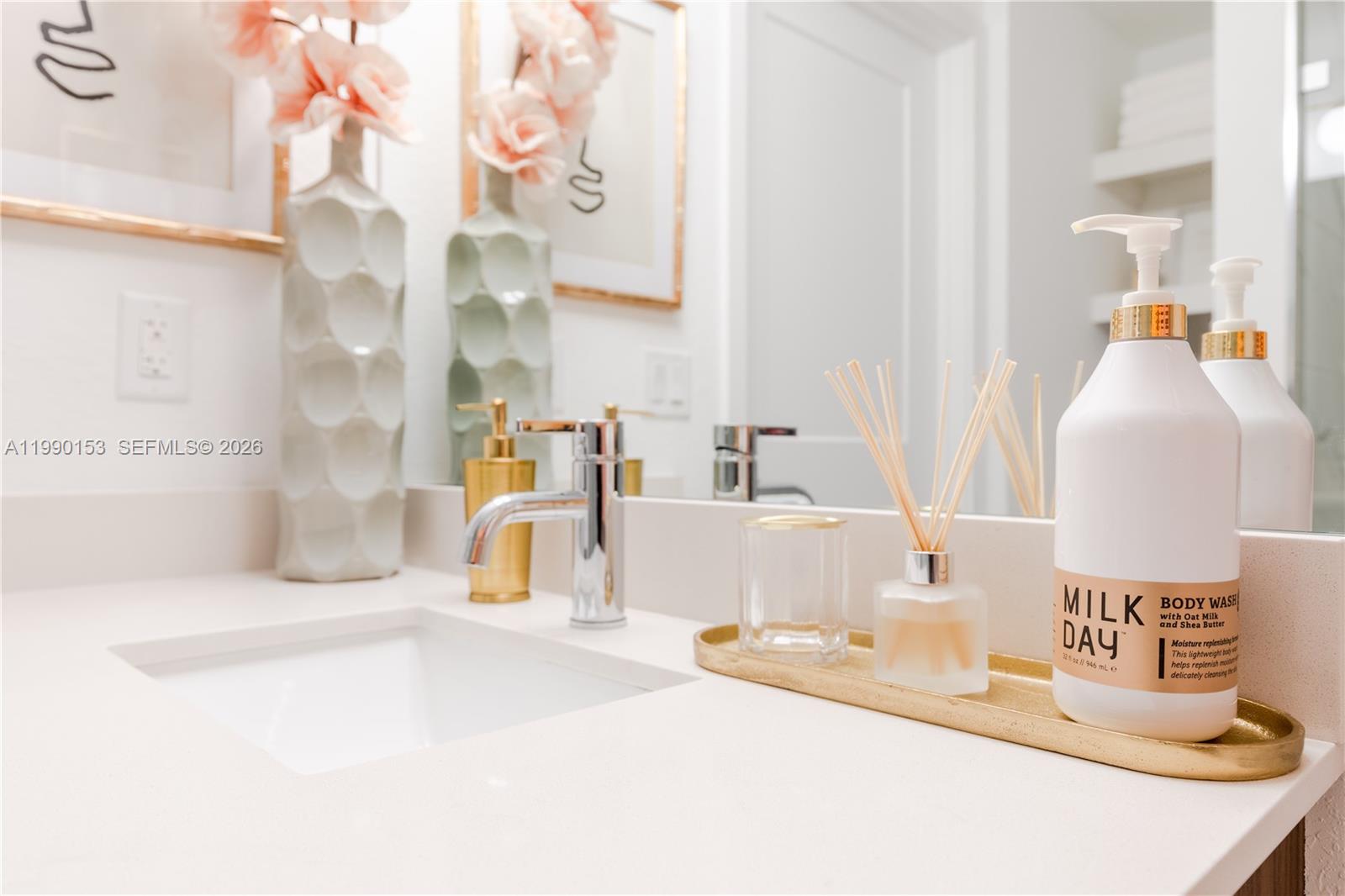 1005 Spring Garden Road, Unit 748 Miami, FL 33136 - Photo 10 of 35 a bathroom with a sink and a mirror