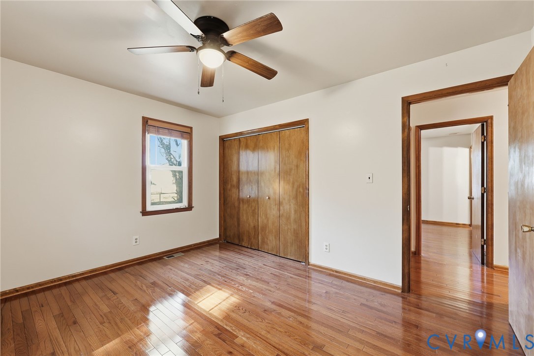 2521 Fort Lee Road Petersburg, VA 23805 - Photo 13 of 27 a view of an empty room with a window and wooden floor