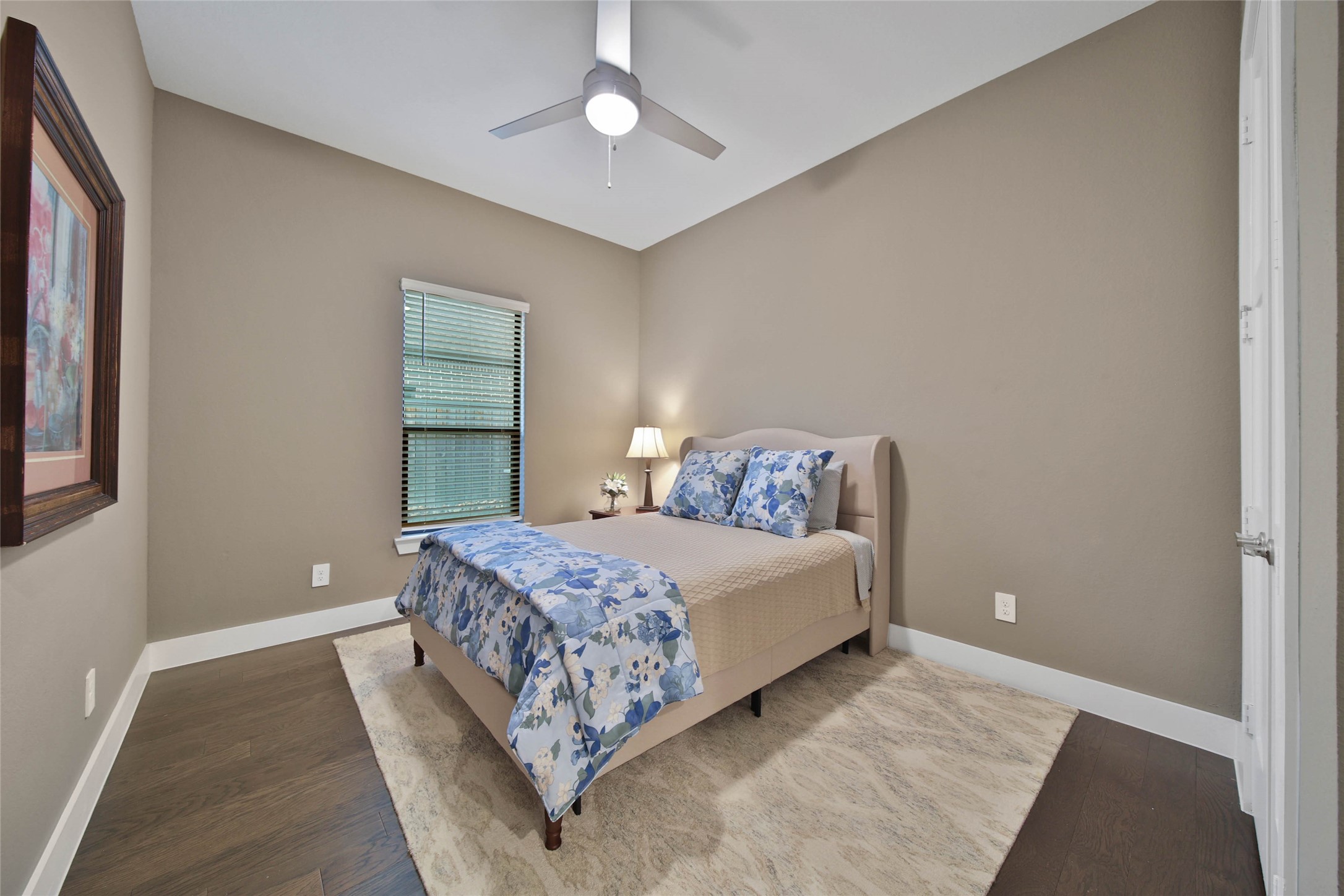 1015 Oak Briar Lane Conroe, TX 77384 - Photo 36 of 50 a bedroom with a bed and a chandelier