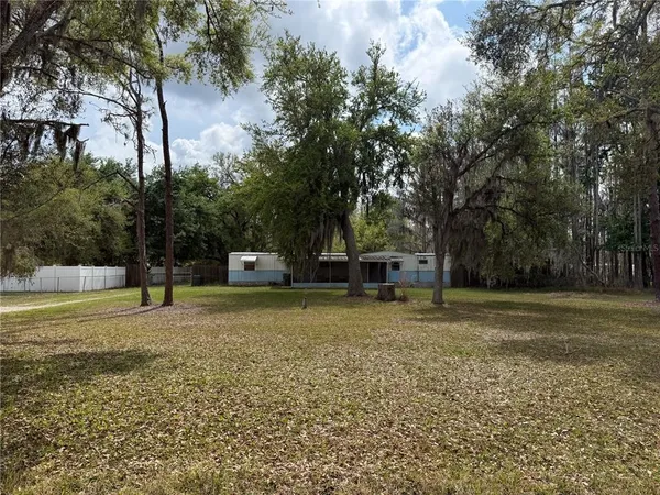 a house with trees in front of it