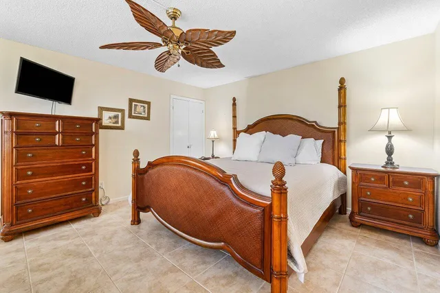 a bedroom with a bed and a tv