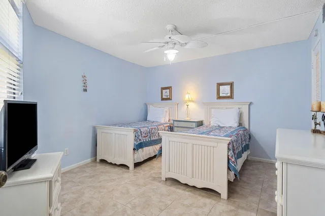 a room with a bed and a flat screen tv