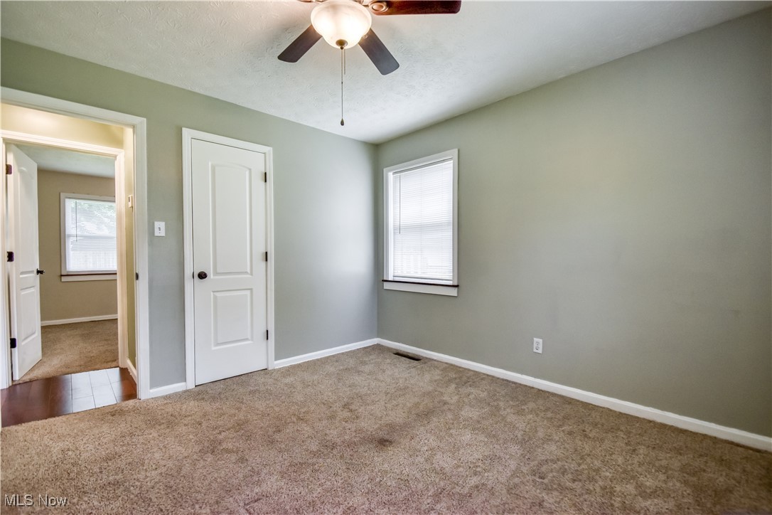 1919 Sandgate Road Madison, OH 44057 - Photo 19 of 28 Unfurnished bedroom featuring carpet and ceiling fan